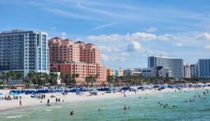 Scenic view of Clearwater Beach Florida Gulf Coast shoreline showing white sand and ocean water representing coastal lifestyle near neighborhoods served by Bereket Moving and Storage